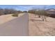 Wide paved pathway meandering through a desert landscape at 21024 E Poco Calle St, Queen Creek, AZ 85142