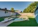 Refreshing backyard pool with diving board and artificial turf at 217 E Bruce Ave, Gilbert, AZ 85234