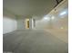 Spacious three-car garage with white walls at 22874 E Alyssa Rd, Queen Creek, AZ 85142