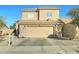 Two-story house with a large garage and well-maintained landscaping at 3444 E Melody Dr, Phoenix, AZ 85042