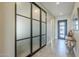 Bright entryway with modern frosted glass doors at 36073 N Stoneware Dr, Queen Creek, AZ 85140