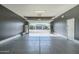 Spacious garage with epoxy flooring and extra storage at 36073 N Stoneware Dr, Queen Creek, AZ 85140