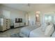 Bright main bedroom with ensuite bathroom access at 36073 N Stoneware Dr, Queen Creek, AZ 85140