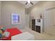 Charming bedroom with red bedding and built-in storage at 3701 E Sat Nam Way, Cave Creek, AZ 85331