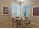 Charming breakfast nook with glass-top table and four chairs at 3701 E Sat Nam Way, Cave Creek, AZ 85331