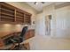 Bright home office with built-in desk and access to hallway at 3701 E Sat Nam Way, Cave Creek, AZ 85331