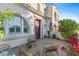 Relaxing patio with wicker furniture and vibrant flowers at 4077 S Sabrina Dr # 130, Chandler, AZ 85248