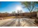 Sunny backyard with gravel and grassy areas at 42414 N 46Th Ln, Phoenix, AZ 85086