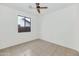 Bedroom with ceiling fan and window at 4446 W Apollo Rd, Laveen, AZ 85339