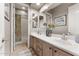 Elegant bathroom with double vanity and shower/tub combo at 6445 S Honor Ct, Gilbert, AZ 85298