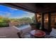 Outdoor patio with seating area and view of a small pool at 6617 E Evening Glow Dr, Scottsdale, AZ 85266