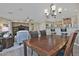 Casual dining area with table and chairs, open to living room at 6710 W Sandpiper Way, Florence, AZ 85132