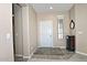 Bright and airy entryway with tiled floor and a small rug at 6710 W Sandpiper Way, Florence, AZ 85132