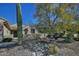 Landscaped front yard with desert plants and a rock pathway at 6710 W Sandpiper Way, Florence, AZ 85132