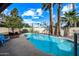 Inviting kidney-shaped pool with brick patio and lush landscaping at 6812 E Friess Dr, Scottsdale, AZ 85254