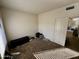 Second bedroom with carpet flooring and a door at 9209 N 59Th Ave # 105, Glendale, AZ 85302