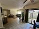 Spacious living room with tiled floors and patio access at 9209 N 59Th Ave # 105, Glendale, AZ 85302