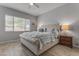 Main bedroom with plush bed, nightstand and window coverings at 931 E Holland Park Dr, Gilbert, AZ 85297