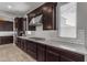 Modern kitchen with white subway tile backsplash and dark cabinetry at 931 E Holland Park Dr, Gilbert, AZ 85297