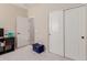 Bedroom with closet, built in shelving, and a door leading to a hallway at 941 S 200Th Ln, Buckeye, AZ 85326