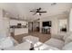 Open kitchen with white cabinets, an island, and stainless steel appliances at 941 S 200Th Ln, Buckeye, AZ 85326