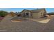 Spacious backyard with patio and gravel landscaping at 9930 W Concord Ave, Sun City, AZ 85351