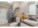 Clean bathroom with granite vanity, a shower/tub combo, and updated fixtures at 1045 E Cloud Rd, Phoenix, AZ 85086