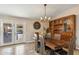 Bright dining room adjacent to kitchen, featuring a rustic wooden table at 1045 E Cloud Rd, Phoenix, AZ 85086