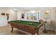 Relaxing game room with pool table, dartboard, and natural light at 1045 E Cloud Rd, Phoenix, AZ 85086
