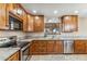 Kitchen with granite countertops and wood cabinets at 1045 E Cloud Rd, Phoenix, AZ 85086