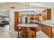 Kitchen island with granite countertop and breakfast bar seating at 1045 E Cloud Rd, Phoenix, AZ 85086