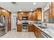 Modern kitchen with stainless steel appliances and wood cabinets at 1045 E Cloud Rd, Phoenix, AZ 85086