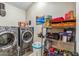 Convenient laundry room with washer, dryer, and shelving at 1045 E Cloud Rd, Phoenix, AZ 85086