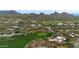 Luxury homes, golf course, lake, and mountain views in a desert setting at 10542 E Skinner Dr, Scottsdale, AZ 85262