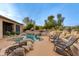 Desert landscape with inviting pool, spa, and patio; perfect for relaxation at 10542 E Skinner Dr, Scottsdale, AZ 85262