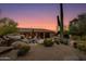 Peaceful backyard with a view of the desert landscape and a large cactus at 10542 E Skinner Dr, Scottsdale, AZ 85262