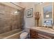 Clean bathroom with a shower/tub combo and wood vanity at 10542 E Skinner Dr, Scottsdale, AZ 85262