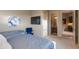 Bedroom with a view into other rooms and a blue velvet chair at 10542 E Skinner Dr, Scottsdale, AZ 85262