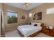 Bedroom with a king-size bed and wood frame, featuring desert views at 10542 E Skinner Dr, Scottsdale, AZ 85262