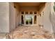Elegant entryway with double doors and stone flooring at 10542 E Skinner Dr, Scottsdale, AZ 85262