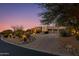 Luxury desert home with three-car garage and desert landscaping at 10542 E Skinner Dr, Scottsdale, AZ 85262