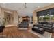 Open Gathering room with hardwood floors and views of the backyard at 10542 E Skinner Dr, Scottsdale, AZ 85262