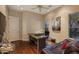 Home office with a desk, leather couch, and large artwork at 10542 E Skinner Dr, Scottsdale, AZ 85262