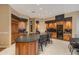Gourmet kitchen featuring a large island and wood cabinetry at 10542 E Skinner Dr, Scottsdale, AZ 85262