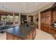 Island kitchen with dark countertops and views to backyard at 10542 E Skinner Dr, Scottsdale, AZ 85262