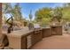 Stainless steel grill and built-in outdoor kitchen at 10542 E Skinner Dr, Scottsdale, AZ 85262