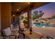 Relaxing patio with seating area and stunning pool and desert views at 10542 E Skinner Dr, Scottsdale, AZ 85262