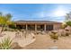 Flagstone patio with seating area and views of the pool and backyard at 10542 E Skinner Dr, Scottsdale, AZ 85262