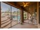 Screened-in patio overlooking a sparkling pool and desert landscape at 10542 E Skinner Dr, Scottsdale, AZ 85262