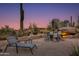 Enjoy desert evenings on this patio with comfortable seating and outdoor lighting at 10542 E Skinner Dr, Scottsdale, AZ 85262
